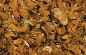 Chooped seafood pino A savory mix of sautéed onions, paprika, and chopped assorted seafood ready for filling.