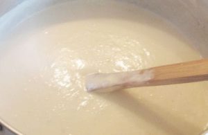 Creamy Milk The action of carefully separating an egg yolk from the white over a glass bowl.