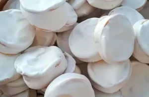 Chilenitos-with-manjar Assembling Chilenitos by stacking thin hojarascas filled with thick Chilean manjar and covering with meringue
