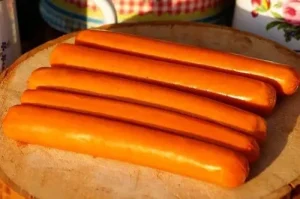 Sausages or viennas Beef and pork sausages (viennas) being boiled in a pot of hot water for a traditional hot dog recipe.