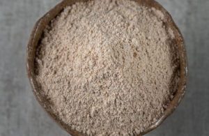 Toasted flour A bowl of fine, light-brown toasted wheat flour, a staple ingredient in traditional Chilean beverages.