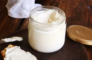 Cream Cheese Cream cheese and sour cream being prepared as the base for a smooth seafood pâté.