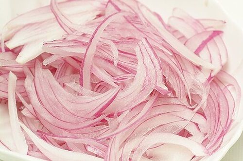 Red onion sliced into thin strips for the ceviche