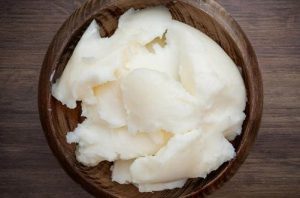natural pork lard Block of natural pork lard melting in a pot, showing its pure and stable texture.