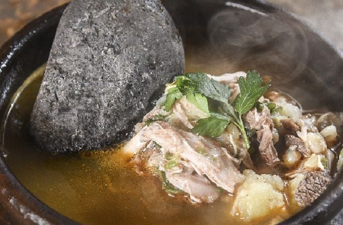 Chilean Calapurca — Traditional Aymara Soup with Hot River Stones Chilean calapurca (kalapurca) — Aymara soup of llama meat, hominy corn, and potatoes finished with a glowing-hot river stone
