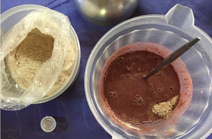 Chilean Pihuelo — Traditional Chicha de Uva and Toasted Flour Cocktail from Santiago A tall glass of Chilean pihuelo showing the mixture of grape chicha and toasted flour with a light foam layer on the surface