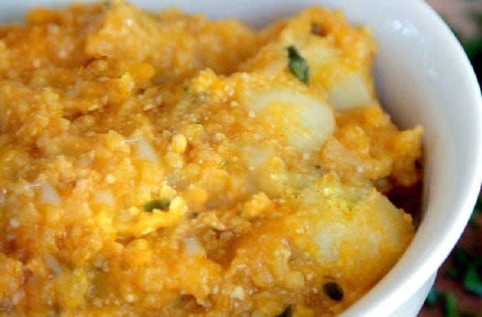 Chilean Potatoes with Chuchoca — Homemade Papas con Chuchoca Recipe Chilean Papas con Chuchoca — hearty potato and dried corn stew with squash in clay bowl