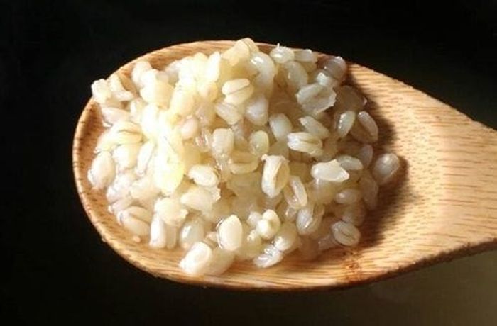 Step 1 — Cooked hulled wheat (mote) added to milk infused with cinnamon, orange peel, and vanilla Cooked hulled wheat (mote de trigo) drained and ready to add to spiced milk for Chilean mote con manjar