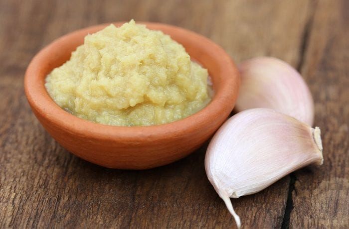 Step 2 — Garlic and onion softened in olive oil over medium heat Sautéed garlic and onion sofrito for the base of Chilean baked corvina al horno