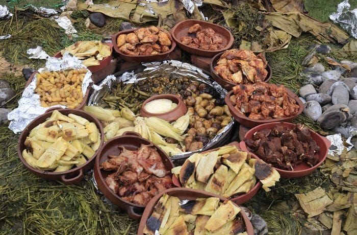 Quechua Pachamanka — Traditional Andean Earth Oven Recipe Quechua Pachamanka — traditional Andean earth oven dish with meats, potatoes, and humitas cooked over hot stones