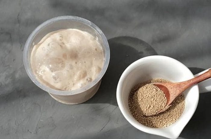 Active Yeast for Pan de Leche Active dry yeast dissolving in warm milk and sugar — the first step for Chilean pan de leche