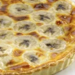 Chilean banana kuchen (kuchen de platano) — homemade tart with ripe banana slices and pastry cream on a butter shortcrust base, southern Chile style
