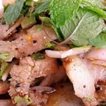 Chilean campesino pork causeo — traditional cold pork offal salad with potatoes, eggs and fresh herbs