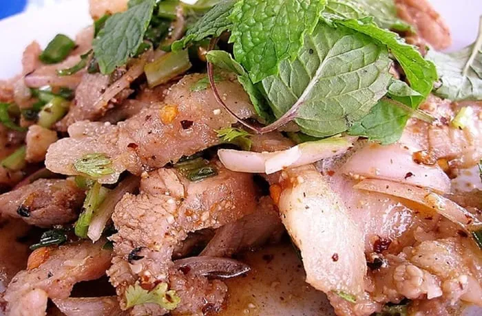 Chilean campesino pork causeo — traditional cold pork offal salad with potatoes, eggs and fresh herbs