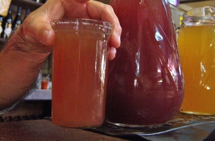 Chilean chichón cocktail — equal parts grape chicha and pipeño wine in a tall glass