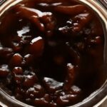 Glass jar of Chilean cochayuyo seaweed jam with visible seaweed pieces and amber color