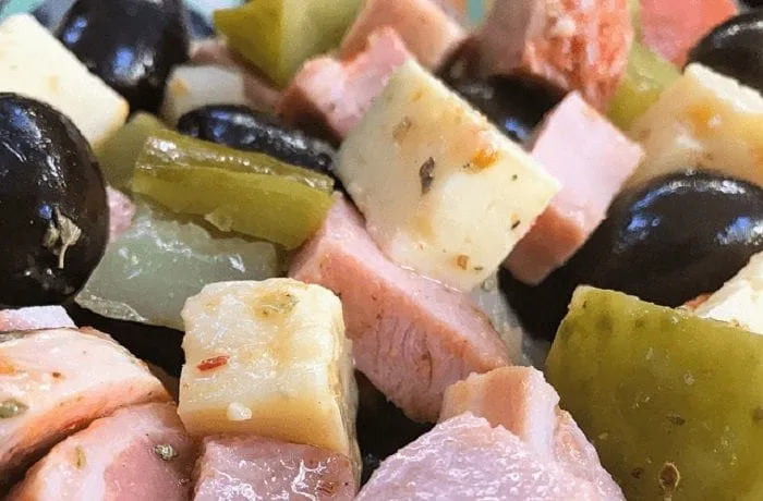 Chilean cold pichanga fría — deli meats, cheese, olives and pickles in a sharing platter