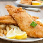 Chilean fried pejerrey (silverside) — crispy beer batter fish served with lemon