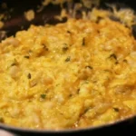 Chilean hake scrambled eggs with merkén — revuelto de merluza con huevos served with marraqueta bread