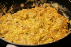 Chilean hake scrambled eggs with merkén — revuelto de merluza con huevos served with marraqueta bread