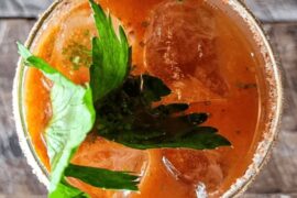 Chilean michemar: lager beer with marinated piure and fresh clams, salted and merkén-rimmed glass