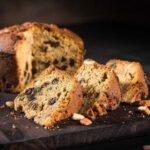 Chilean pan de pascua sliced — a dense Christmas fruitcake with candied fruit, walnuts and raisins