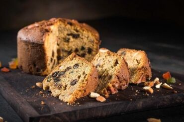 Chilean pan de pascua sliced — a dense Christmas fruitcake with candied fruit, walnuts and raisins