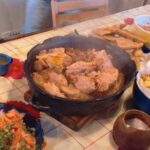 Chilean pollona de Los Ángeles — chicken, pork ribs and longanizas stew served hot with broth
