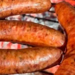 Chilean San Carlos artisanal longaniza sausages — handcrafted with pork loin, paprika, and natural casing, grilled until golden
