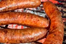 Chilean San Carlos artisanal longaniza sausages — handcrafted with pork loin, paprika, and natural casing, grilled until golden