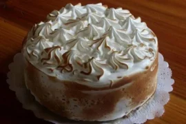 Chilean tres leches cake — homemade three-milk sponge cake soaked with condensed milk, evaporated milk and cream, topped with Swiss meringue