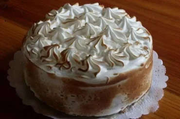 Chilean tres leches cake — homemade three-milk sponge cake soaked with condensed milk, evaporated milk and cream, topped with Swiss meringue