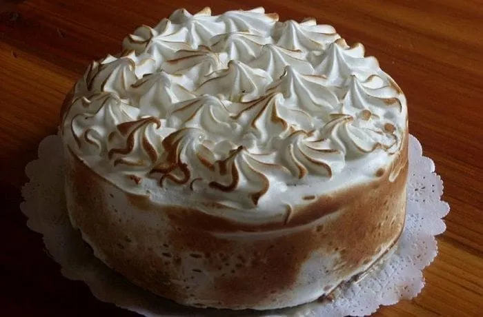 Chilean tres leches cake — homemade three-milk sponge cake soaked with condensed milk, evaporated milk and cream, topped with Swiss meringue