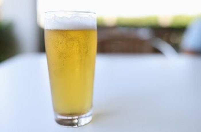 Cold lager beer — the carbonated liquid that makes pejerrey batter light and crispy