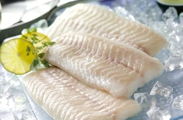 Fresh hake fillets (merluza) prepared for the Chilean revuelto de merluza con huevos — skin and bones removed before cooking