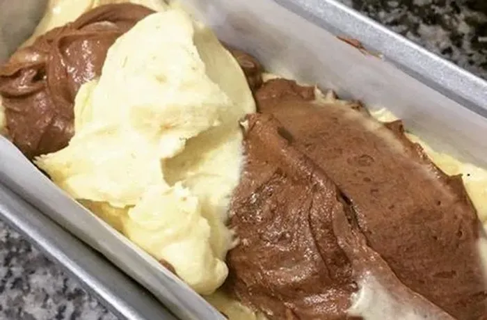 Mixing the marble cake batter with butter, sugar and eggs
