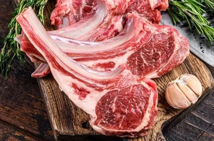 Fresh Patagonian lamb ribs trimmed and seasoned with salt and pepper before searing — 2 kg serves 4 people