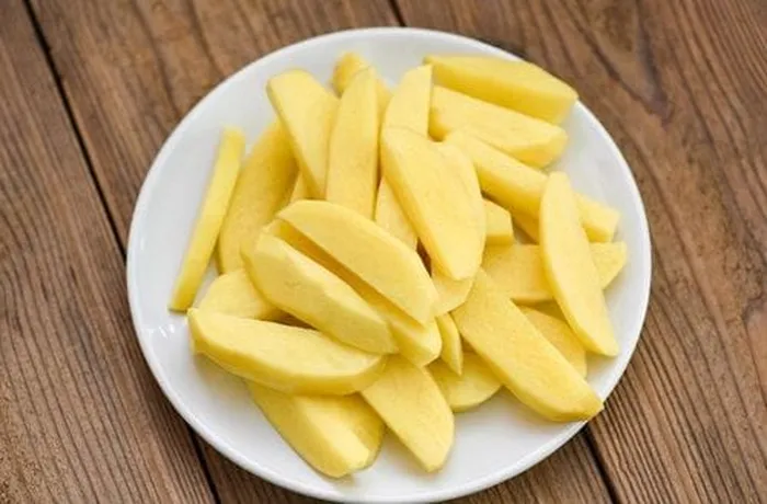 Large potatoes cut into quarters for the Chilean caldillo de jurel — they cook in the broth for 15 minutes until tender