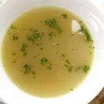Chilean sopa de locos abalone soup served hot in a bowl with fresh cilantro