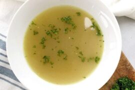 Chilean sopa de locos abalone soup served hot in a bowl with fresh cilantro