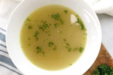 Chilean sopa de locos abalone soup served hot in a bowl with fresh cilantro