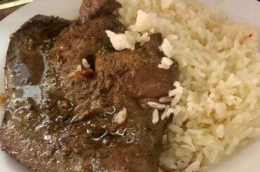 Chilean bistec de pana al ajo — garlic-marinated beef liver steaks served with rice
