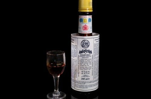 Angostura bitters Bottle of Angostura bitters, the main bitter liquor used in the recipe.