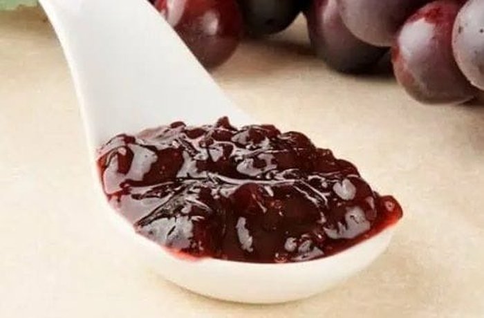 Thick dark arrope de uva, reduced grape syrup