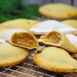 Chilean alcayota jam empanadas, baked golden brown, a popular Fiestas Patrias sweet treat.