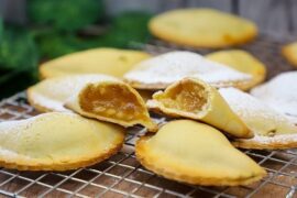 Chilean alcayota jam empanadas, baked golden brown, a popular Fiestas Patrias sweet treat.