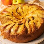 Chilean apple loaf cake with sliced apple on top and powdered sugar