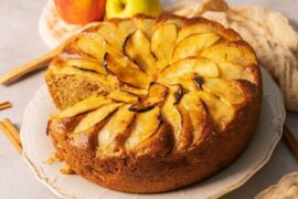 Chilean apple loaf cake with sliced apple on top and powdered sugar