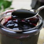 Bowl of Chilean arrope de uva, a thick dark grape syrup ready to be served over desserts