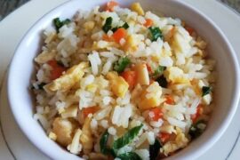 Homemade arroz chaufán with egg, turkey ham, and scallions